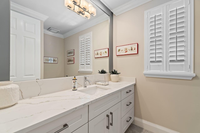 220 Carina Dr, Jupiter, FL 33478 - bathroom featuring vanity, baseboards, and crown molding
