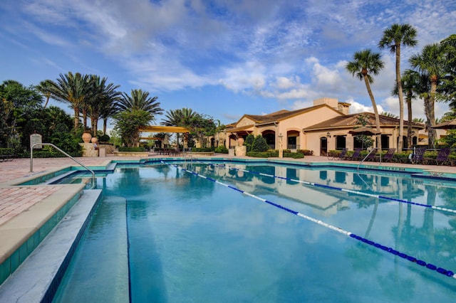 220 Carina Dr, Jupiter, FL 33478 - community pool featuring a patio