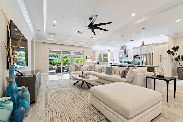 220 Carina Dr, Jupiter, FL 33478 - living area with ceiling fan, crown molding, a raised ceiling, and recessed lighting