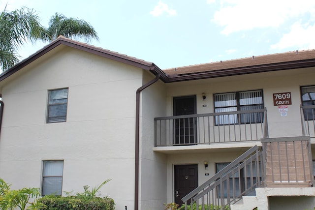 7609 Tahiti Ln Unit 201, Lake Worth, FL 33467 - view of building exterior featuring stairway