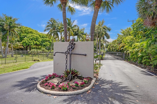 2424 N Federal Hwy Unit 315, Boynton Beach, FL 33435 - community sign featuring a gate and view of wooded area