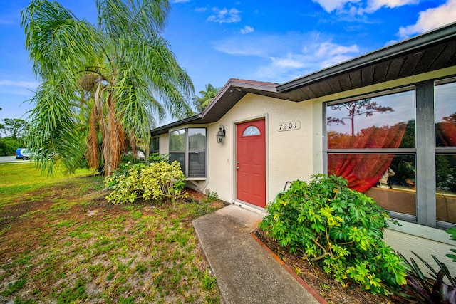 7201 N Blvd, Fort Pierce, FL 34951 - property entrance featuring stucco siding
