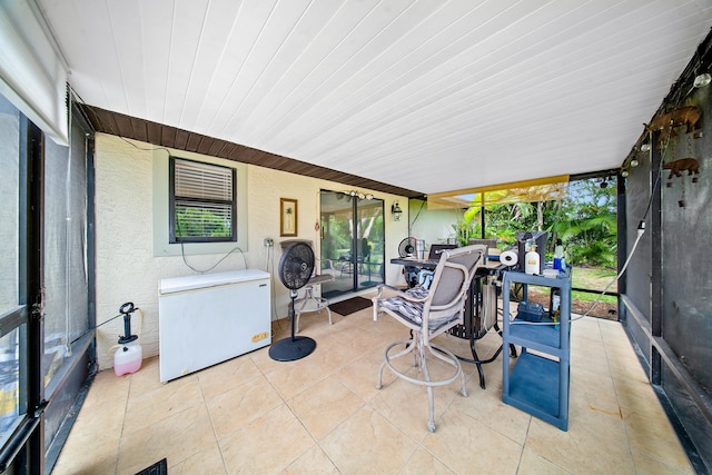 7201 N Blvd, Fort Pierce, FL 34951 - sunroom / solarium with tile patterned floors and outdoor dining space