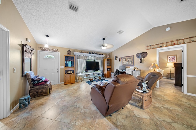 7201 N Blvd, Fort Pierce, FL 34951 - living room with vaulted ceiling, ceiling fan, a textured ceiling, and baseboards