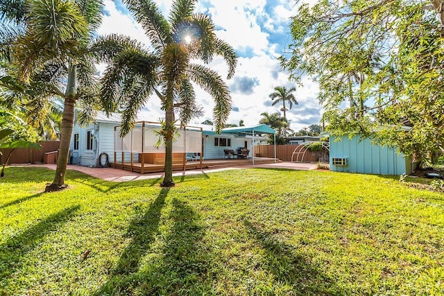 235 30th St, West Palm Beach, FL 33407 - view of yard featuring a patio area and a wooden deck