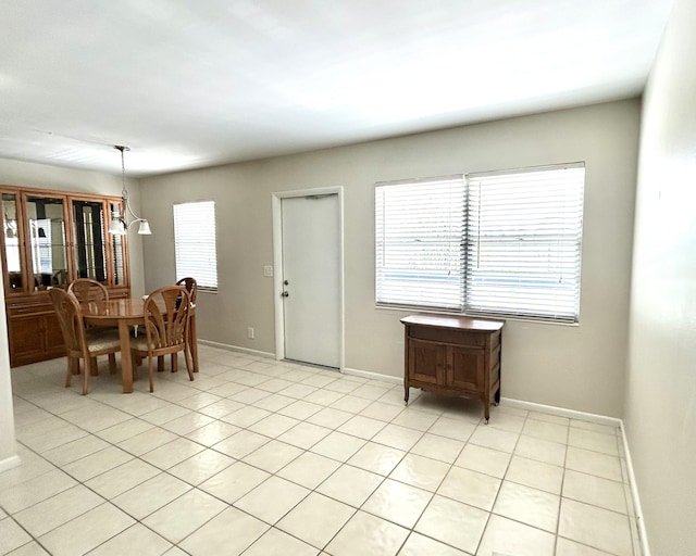 3026 Lincoln B 3026, Boca Raton, FL 33434 - dining room featuring healthy amount of natural light, baseboards, and light tile patterned floors