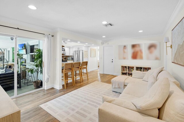 769 Berkeley St, Boca Raton, FL 33487 - living room with light wood-type flooring, crown molding, recessed lighting, and baseboards