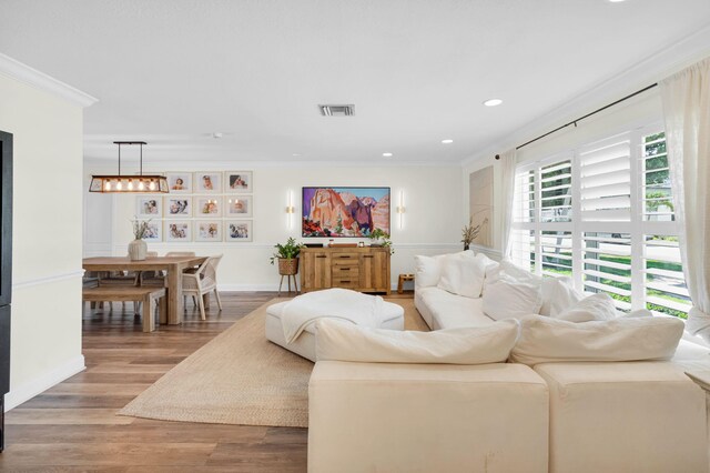 769 Berkeley St, Boca Raton, FL 33487 - living area with crown molding, wood finished floors, recessed lighting, and baseboards