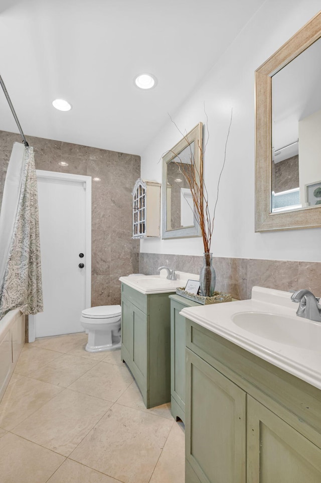 769 Berkeley St, Boca Raton, FL 33487 - full bathroom featuring tile walls, two vanities, toilet, and tile patterned floors