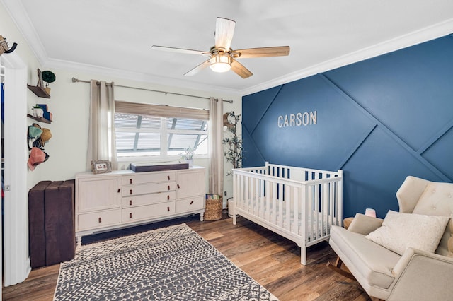 769 Berkeley St, Boca Raton, FL 33487 - bedroom with crown molding, a crib, wood finished floors, and ceiling fan