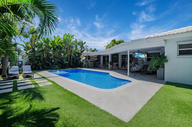 769 Berkeley St, Boca Raton, FL 33487 - outdoor pool with a patio and a yard