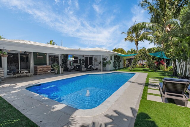 769 Berkeley St, Boca Raton, FL 33487 - outdoor pool with a ceiling fan, a patio area, a yard, and outdoor lounge area