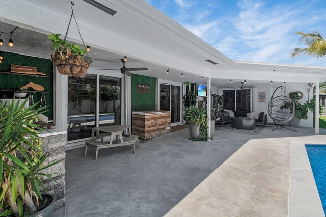 769 Berkeley St, Boca Raton, FL 33487 - view of patio featuring a ceiling fan, an outdoor living space, and an outdoor pool