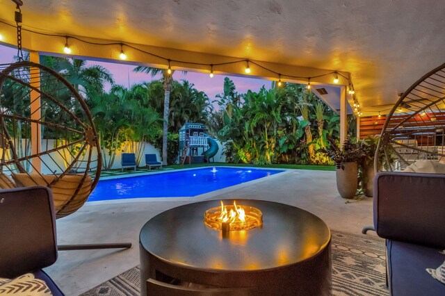 769 Berkeley St, Boca Raton, FL 33487 - view of pool with a fire pit and a patio