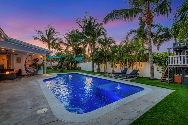 769 Berkeley St, Boca Raton, FL 33487 - view of swimming pool featuring an outdoor fire pit, a patio area, and a playground