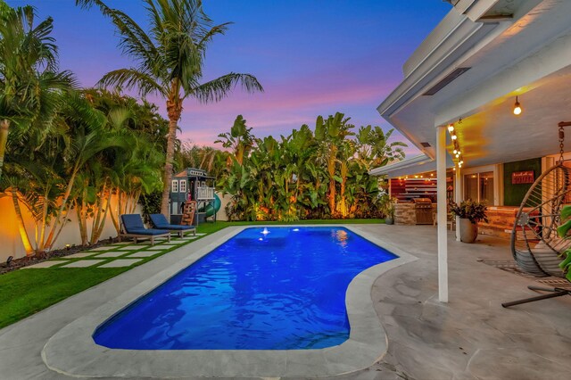 769 Berkeley St, Boca Raton, FL 33487 - view of pool with an outdoor kitchen, a fenced backyard, and a patio area