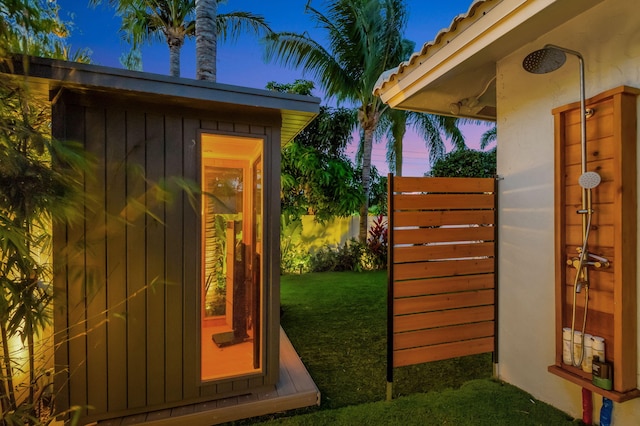 769 Berkeley St, Boca Raton, FL 33487 - outdoor structure at dusk with a lawn