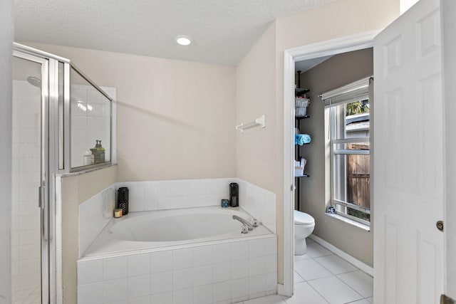 3182 SW Cathedral St, Port Saint Lucie, FL 34953 - full bathroom with toilet, a garden tub, a shower stall, tile patterned floors, and a textured ceiling