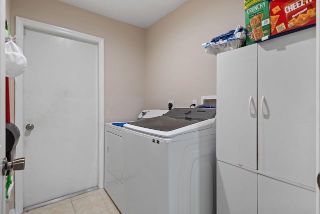 3182 SW Cathedral St, Port Saint Lucie, FL 34953 - laundry room with washing machine and dryer and light tile patterned floors