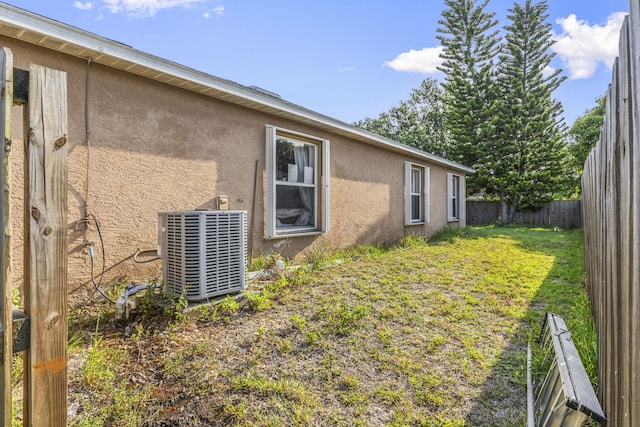 3182 SW Cathedral St, Port Saint Lucie, FL 34953 - view of yard featuring central AC