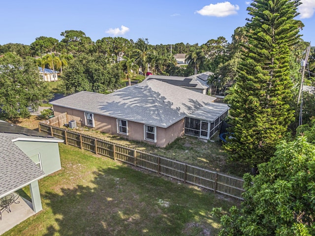 3182 SW Cathedral St, Port Saint Lucie, FL 34953 - view of subject property with a tree filled landscape