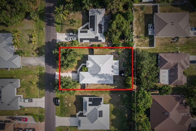 3182 SW Cathedral St, Port Saint Lucie, FL 34953 - aerial view of residential area with property parcel outlined
