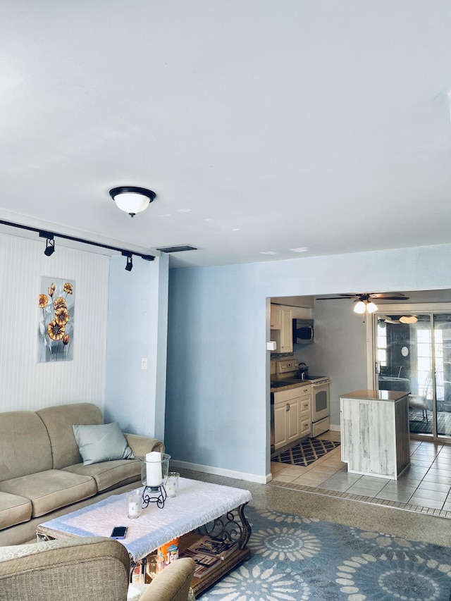 3093 SW Berry Ave, Palm City, FL 34990 - living room featuring baseboards
