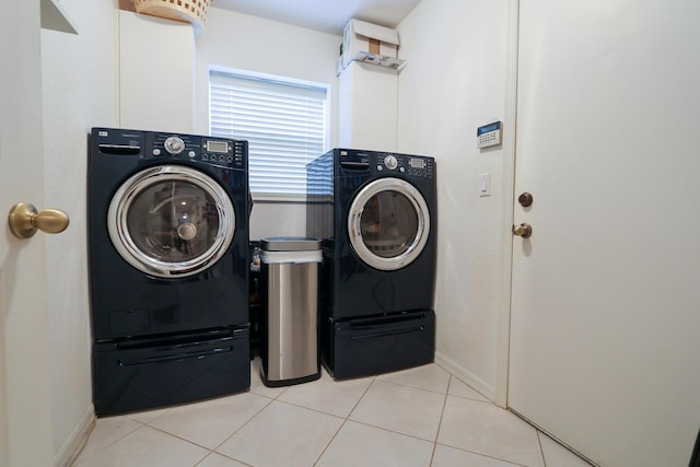 4245 Bluff Harbor Way, Wellington, FL 33449 - laundry room with independent washer and dryer, baseboards, and tile patterned floors