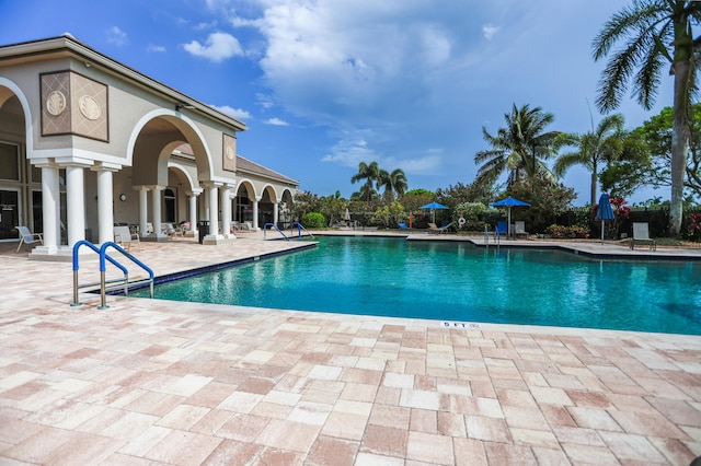 4245 Bluff Harbor Way, Wellington, FL 33449 - community pool with a patio area