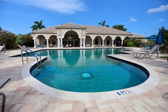 4245 Bluff Harbor Way, Wellington, FL 33449 - community pool with a patio area