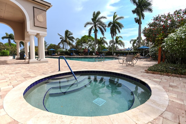 4245 Bluff Harbor Way, Wellington, FL 33449 - community pool featuring a hot tub and a patio