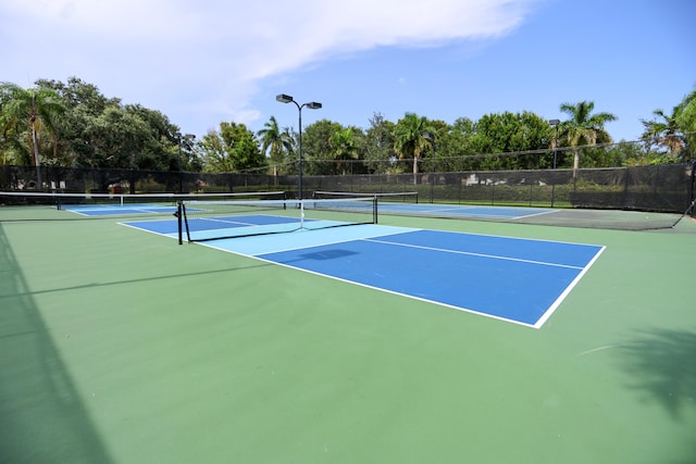 4245 Bluff Harbor Way, Wellington, FL 33449 - view of tennis court featuring community basketball court and view of wooded area