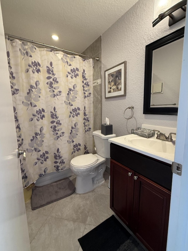 478 Capri J, Delray Beach, FL 33484 - bathroom with a textured ceiling, toilet, vanity, a textured wall, and curtained shower