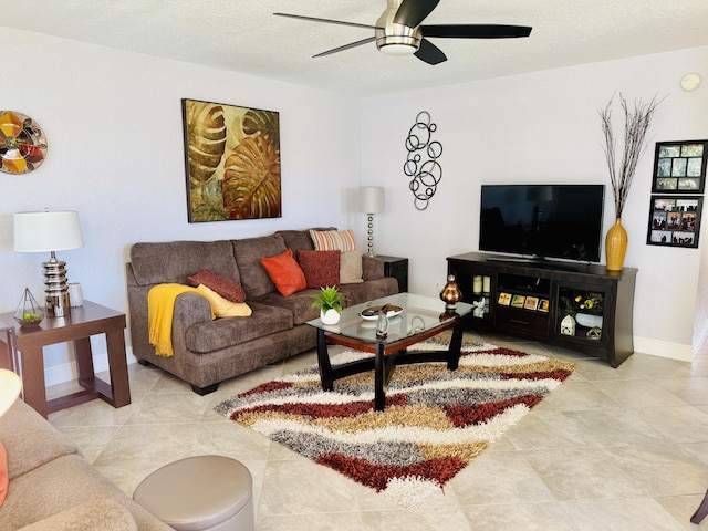 478 Capri J, Delray Beach, FL 33484 - living area featuring a ceiling fan, tile patterned floors, and baseboards