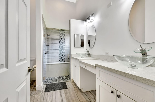7644 Lexington Club Blvd Unit A, Delray Beach, FL 33446 - bathroom featuring double vanity and a tile shower