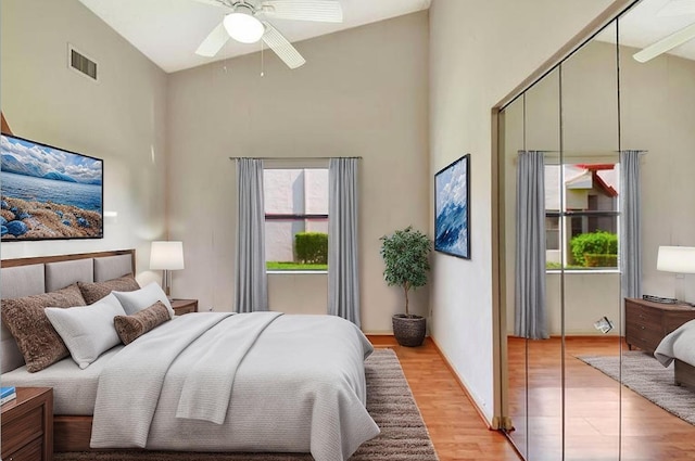 7644 Lexington Club Blvd Unit A, Delray Beach, FL 33446 - bedroom featuring a towering ceiling, light wood-style floors, and a ceiling fan