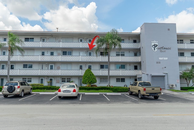 105 NE 19th Ave Unit 356, Deerfield Beach, FL 33441 - view of apartment building / complex featuring uncovered parking