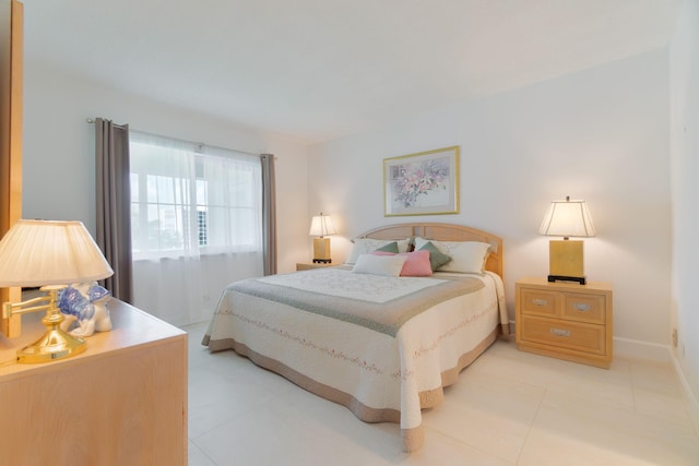 105 NE 19th Ave Unit 356, Deerfield Beach, FL 33441 - bedroom featuring light tile patterned floors and baseboards