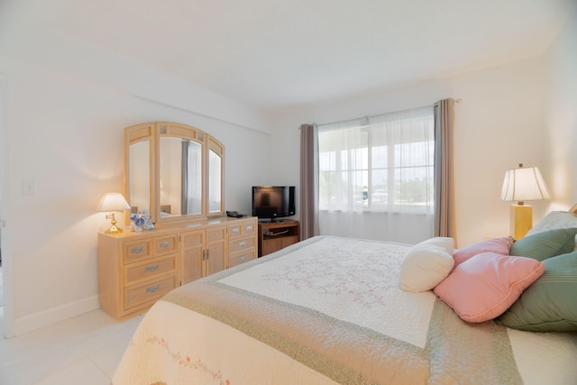 105 NE 19th Ave Unit 356, Deerfield Beach, FL 33441 - bedroom featuring baseboards and light tile patterned floors