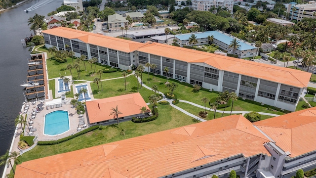 105 NE 19th Ave Unit 356, Deerfield Beach, FL 33441 - bird's eye view of a pool area, a large body of water, and apartment complex