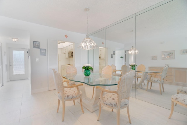 105 NE 19th Ave Unit 356, Deerfield Beach, FL 33441 - dining area featuring a chandelier