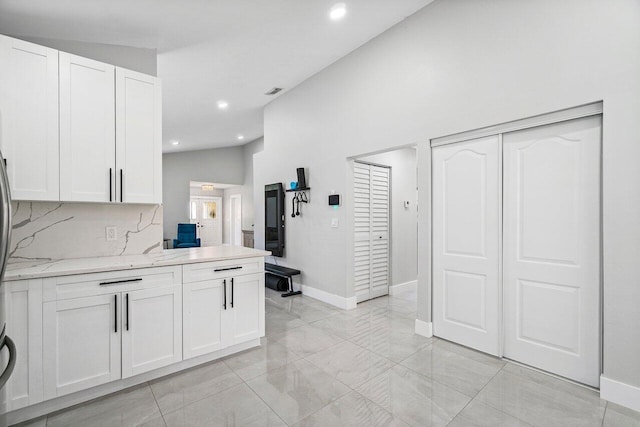 12350 Sand Wedge Dr, Boynton Beach, FL 33437 - kitchen featuring light marble finish flooring, white cabinetry, light stone countertops, and recessed lighting