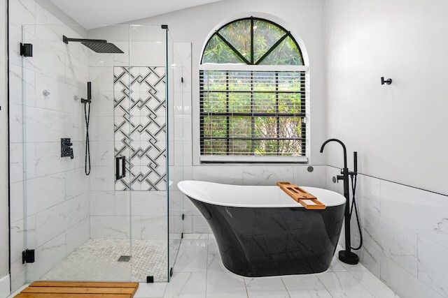 12350 Sand Wedge Dr, Boynton Beach, FL 33437 - full bathroom featuring a freestanding bath, a stall shower, marble look tiles, tile walls, and plenty of natural light