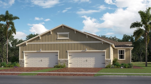 1577 SE Crosswood Way, Port Saint Lucie, FL 34984 - view of front of property with stone siding, a garage, board and batten siding, and driveway