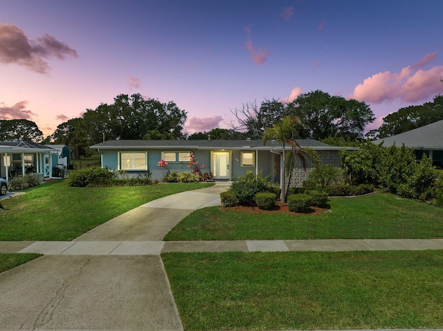 2948 SE Treasure Island Rd, Port Saint Lucie, FL 34952 - ranch-style house with a yard and driveway