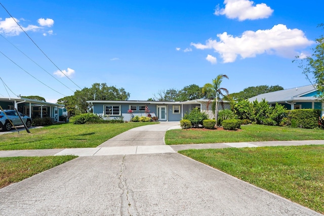 2948 SE Treasure Island Rd, Port Saint Lucie, FL 34952 - single story home with a front lawn and driveway