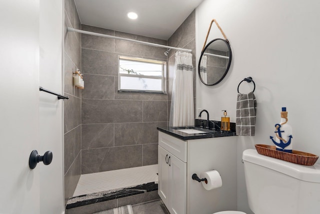 2948 SE Treasure Island Rd, Port Saint Lucie, FL 34952 - bathroom with toilet, vanity, and a tile shower