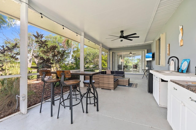 2948 SE Treasure Island Rd, Port Saint Lucie, FL 34952 - sunroom / solarium featuring ceiling fan and outdoor lounge area