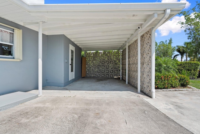 2948 SE Treasure Island Rd, Port Saint Lucie, FL 34952 - view of parking featuring a carport and driveway