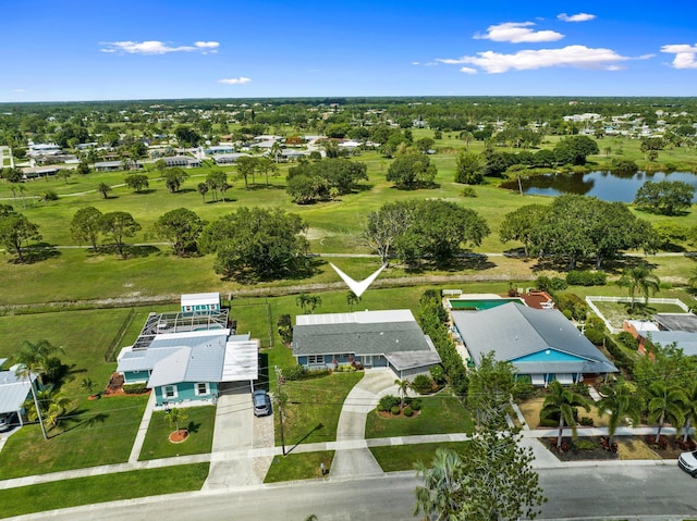 2948 SE Treasure Island Rd, Port Saint Lucie, FL 34952 - aerial view of residential area featuring a large body of water and a local golf course